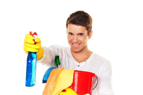 Window cleaner servicing a Hampstead home exterior